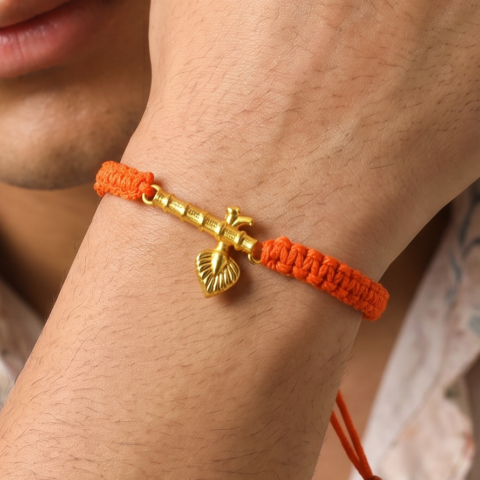 Men - Krishna ji Bansuri 24K Gold - Plated Anti Tarnished Bracelet in Orange Cotton Cord